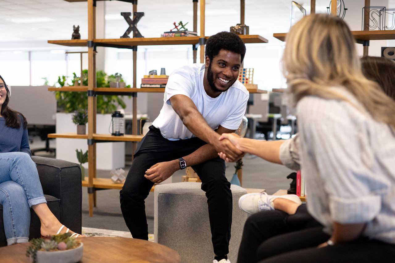 Two Nutanix employees shaking hands