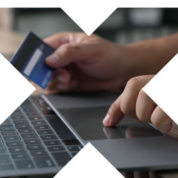Image of person holding credit card